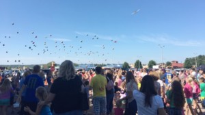 balls dropping from plane